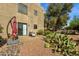 Serene patio with desert landscaping and mature trees at 13636 N Saguaro Blvd # 103, Fountain Hills, AZ 85268