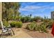 Beautiful backyard area with desert landscaping under a clear blue sky at 13636 N Saguaro Blvd # 103, Fountain Hills, AZ 85268