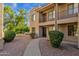 Tan condo featuring a desert landscaped front yard at 13636 N Saguaro Blvd # 103, Fountain Hills, AZ 85268