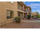 Condo with tan stucco exterior and desert landscaping at 13636 N Saguaro Blvd # 103, Fountain Hills, AZ 85268