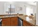 Bright kitchen with stainless steel sink, granite counters, and natural light at 13636 N Saguaro Blvd # 103, Fountain Hills, AZ 85268
