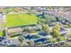 Overhead shot showcasing a community with a sports field, pool, parking, and green spaces at 1482 S Banning St, Gilbert, AZ 85296