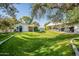 Well-maintained home on a lush green lawn with a carport at 1482 S Banning St, Gilbert, AZ 85296