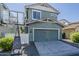 Two-story home features a basketball hoop and a two-car garage at 1482 S Banning St, Gilbert, AZ 85296