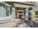 Welcoming front porch with a cozy swing, ample seating, and charming decorative touches at 1482 S Banning St, Gilbert, AZ 85296