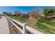 Extensive community garden with thriving greenery, neat white fencing, and irrigation system at 1482 S Banning St, Gilbert, AZ 85296