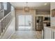Bright kitchen with stainless steel appliances and backyard access through a sliding glass door at 1482 S Banning St, Gilbert, AZ 85296