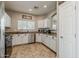 This kitchen has stainless steel appliances, stylish hardware, granite countertops, and a window at 1482 S Banning St, Gilbert, AZ 85296