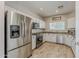 Bright kitchen has stainless steel appliances and white cabinets at 1482 S Banning St, Gilbert, AZ 85296