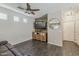 Cozy living room featuring a rustic accent wall, modern lighting, and comfortable furnishings at 1482 S Banning St, Gilbert, AZ 85296
