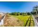 Scenic orchard with mature trees, lush greenery and white fence at 1482 S Banning St, Gilbert, AZ 85296