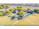 Aerial view of a playground with sunshades, multiple buildings and a path through the area at 1482 S Banning St, Gilbert, AZ 85296