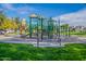 Community playground with green and tan structures on a sunny day at 1482 S Banning St, Gilbert, AZ 85296