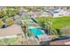 An aerial view showcasing a community pool and tennis courts at 1482 S Banning St, Gilbert, AZ 85296