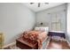 Bedroom features cozy decor, a window for natural light, and a wooden headboard at 15407 W Windrose Dr, Surprise, AZ 85379