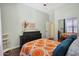 Cozy bedroom with wood floors, a decorative dresser, and a closet at 15407 W Windrose Dr, Surprise, AZ 85379