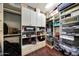 Large walk-in closet with ample storage, built-in shelving, and hanging racks at 15407 W Windrose Dr, Surprise, AZ 85379