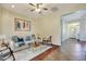 Comfortable living room featuring modern decor, plush seating, and an open layout at 15407 W Windrose Dr, Surprise, AZ 85379