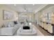 Inviting living room featuring neutral tones, stylish furniture, and plenty of natural light at 15407 W Windrose Dr, Surprise, AZ 85379