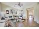Cozy living room featuring modern decor, neutral color palette, and an open floor plan at 15407 W Windrose Dr, Surprise, AZ 85379
