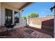 Private patio area with brick and decorative rock features, ideal for outdoor relaxation at 15407 W Windrose Dr, Surprise, AZ 85379