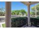 Covered patio featuring elegant columns and outdoor seating with a view of a peaceful neighborhood at 15407 W Windrose Dr, Surprise, AZ 85379
