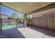 Backyard with covered patio, with pool views from the yard at 15905 W Saguaro Ln, Surprise, AZ 85374