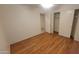 This bedroom features stylish flooring and is equipped with a spacious closet for your convenience at 15905 W Saguaro Ln, Surprise, AZ 85374