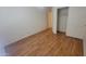 A bright bedroom with hardwood floors and closet space, offers a serene and functional living area at 15905 W Saguaro Ln, Surprise, AZ 85374