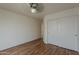Bright bedroom boasts hardwood floors, ceiling fan and large closet for storage at 15905 W Saguaro Ln, Surprise, AZ 85374