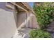 Home's inviting front door with security gate and desert landscaping at 15905 W Saguaro Ln, Surprise, AZ 85374