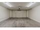 Spacious two-car garage features an automatic door and overhead lighting at 15905 W Saguaro Ln, Surprise, AZ 85374