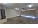 Spacious two-car garage, featuring an installed water heater, and ample room for parking and storage at 15905 W Saguaro Ln, Surprise, AZ 85374