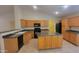 An updated kitchen featuring stainless steel appliances, sleek counter tops, and ample cabinet space at 15905 W Saguaro Ln, Surprise, AZ 85374