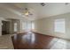 Open living room with a ceiling fan and abundant natural light at 15905 W Saguaro Ln, Surprise, AZ 85374