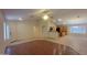 The spacious open concept living room features hard floors that seamlessly connects to the dining and kitchen areas at 15905 W Saguaro Ln, Surprise, AZ 85374