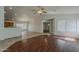 Spacious open-concept living room with a ceiling fan and tiled floors at 15905 W Saguaro Ln, Surprise, AZ 85374