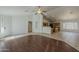 Open-concept living room featuring a ceiling fan and seamlessly flowing floor plan at 15905 W Saguaro Ln, Surprise, AZ 85374