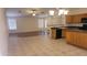 An open-concept living and dining area with recessed lighting and a breakfast bar that enhances connectivity at 15905 W Saguaro Ln, Surprise, AZ 85374