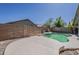 View of the backyard pool and patio surrounded by privacy wall and easy to care for landscape at 15905 W Saguaro Ln, Surprise, AZ 85374