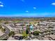 Aerial view of a residential area with homes and community amenities like schools and parks at 18045 W Rimrock St, Surprise, AZ 85388