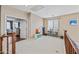 Upstairs bonus room featuring natural light, shelving for toys and an open floor plan at 18045 W Rimrock St, Surprise, AZ 85388