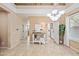 Bright foyer with tile floors, modern decor, and elegant lighting fixtures, creating a welcoming and stylish entrance at 18045 W Rimrock St, Surprise, AZ 85388