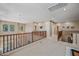 Bright upper hallway overlooking the home's entrance and foyer at 18045 W Rimrock St, Surprise, AZ 85388