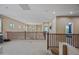 Bright upper hallway overlooking the home's entrance and foyer at 18045 W Rimrock St, Surprise, AZ 85388