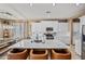 Bright kitchen showcases white cabinets, a marble island, stainless steel appliances, and recessed lighting at 18045 W Rimrock St, Surprise, AZ 85388
