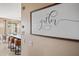 Gather in the modern kitchen area with an island featuring barstool seating and a stylish, open design for entertaining at 18045 W Rimrock St, Surprise, AZ 85388