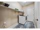 Functional laundry room with modern appliances and ample storage space for convenience at 18045 W Rimrock St, Surprise, AZ 85388