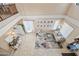 Open-concept living room with vaulted ceiling, neutral color palette, and stylish decor at 18045 W Rimrock St, Surprise, AZ 85388