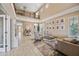 Inviting living room with tall ceilings, natural light, modern furniture, and a stylish, neutral color palette at 18045 W Rimrock St, Surprise, AZ 85388